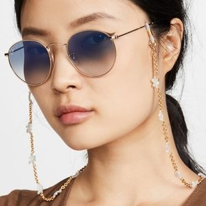 Lele sadoughi white flower and gold sunglasses/mask chain